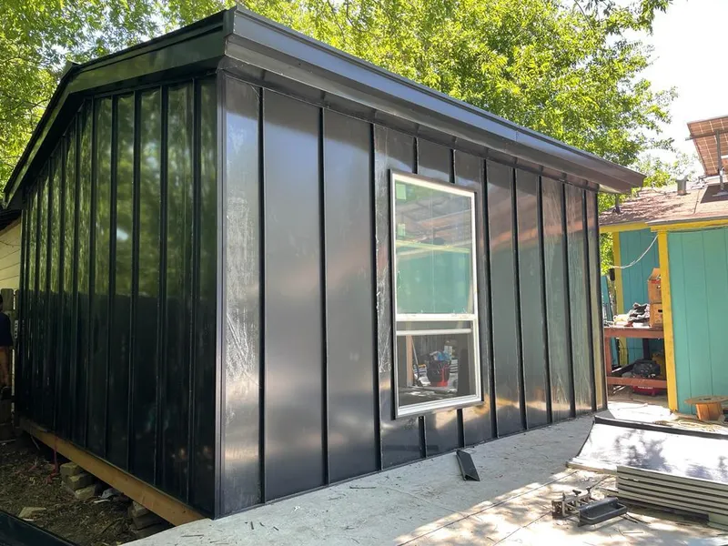 Black standing seam metal wall panels for Metal Roof Installation in East Ridge